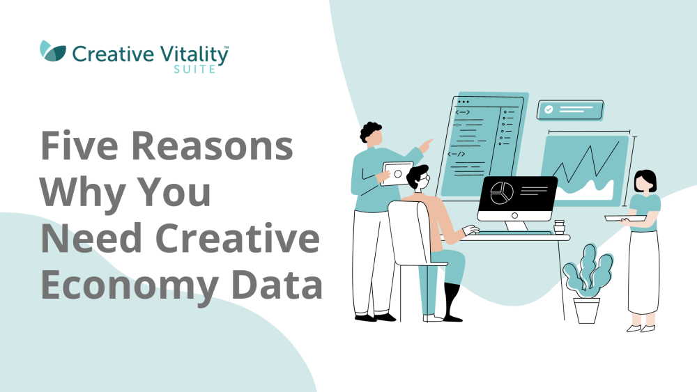 Five Reasons Why You Need Creative Economy Data. Three people sitting and standing looking at a computer screen analyzing data.